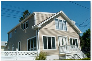 HOME ADDITIONS - We built a large dormer on this New Hampshire home which added lot more useable space and improved its curb appeal.