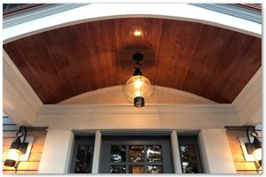 Dark wood stained ceiling in this charming portico.