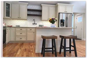 Shaker style cabinets with granite counter tops and a sit down island. New Hampshire renovation.