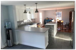 Shaker style cabinets with Corian or granite counter tops a sit down island. New Hampshire remodel.