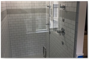 MASTER BATHROOM RENOVATION - We gutted and renovated a master bathroom. We constructed a large two-person shower with body jets and a custom glass shower door.
