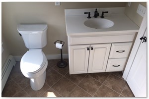 BATHROOM RENOVATION - We install a new 36-inch white maple vanity with pure white Corian top with rubbed bronze Kohler faucet. We installed a 12 x 12 tile in a diamond pattered on the floor. We installed a white comfort height toilet. We finished the bathroom off with matching mirror and light fixture.
