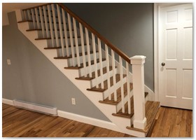 Basement remodel with hardwood staircase